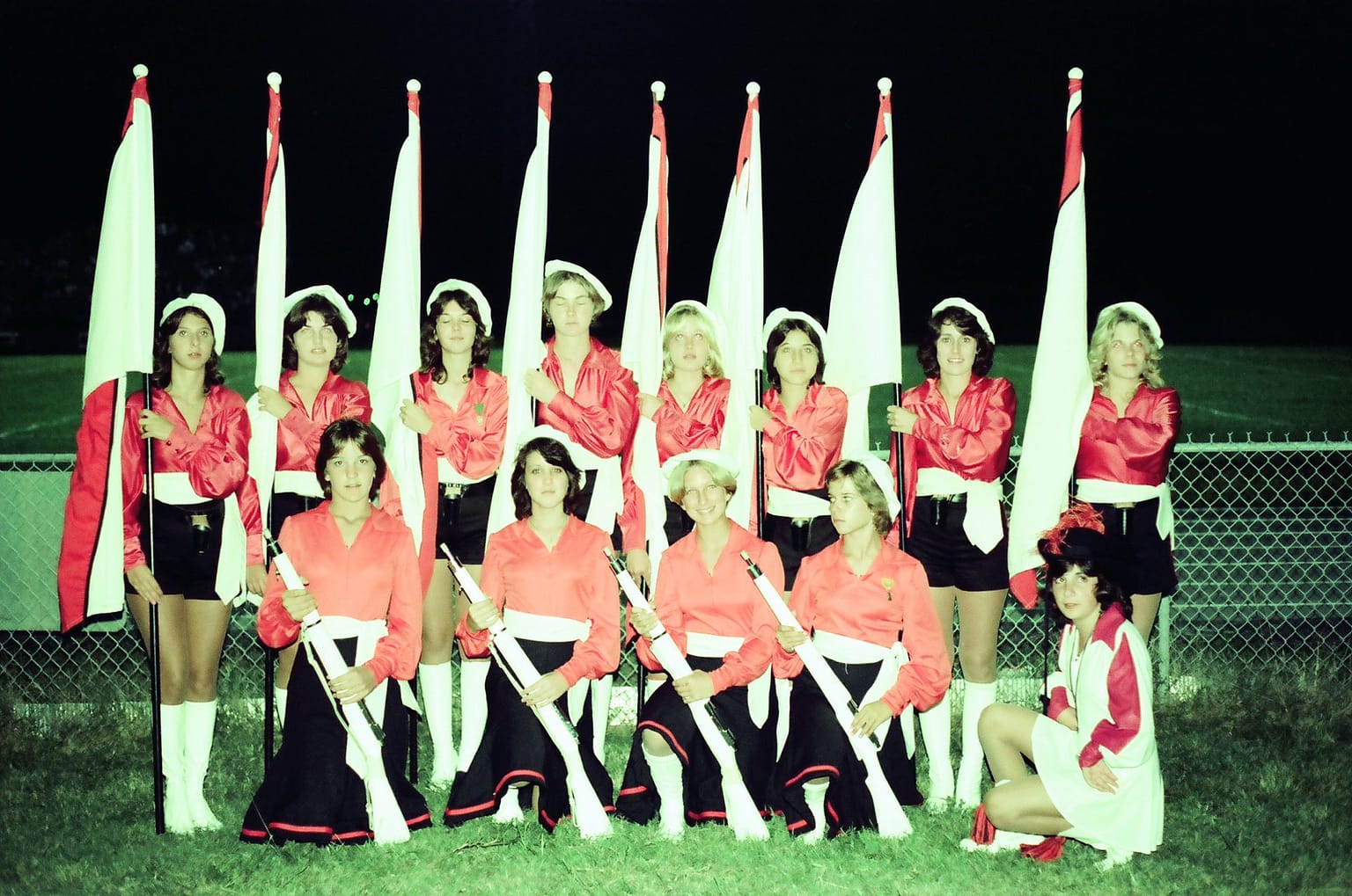 Drum Major Ana Maria Rosato with the talented flag and rifle corps of the SSC Marching Band circa 1977.