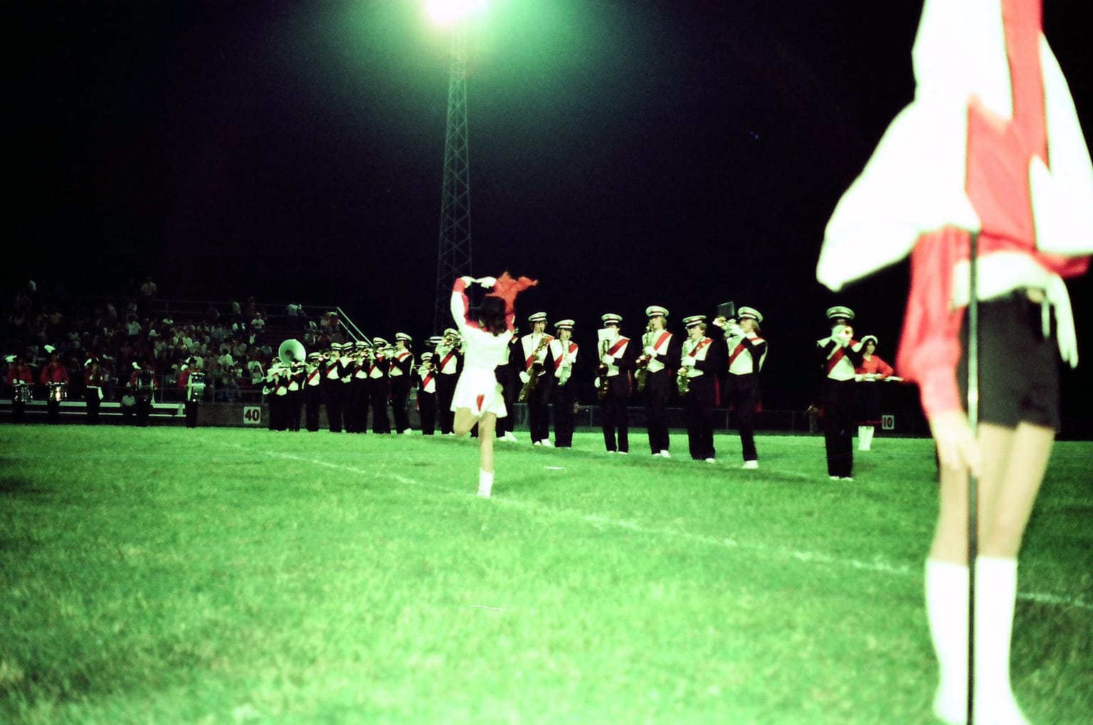 Drum Major Ana Maria Rosato performs with the SSC Marching Band at a high school football game.