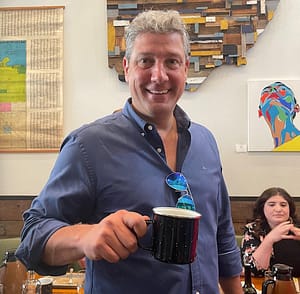 Rep. Tim Ryan with a coffee cup in a coffee house
