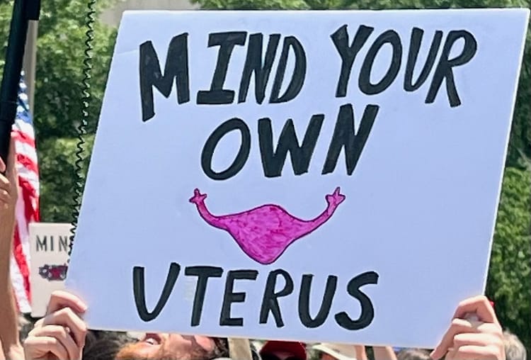 Mind Your Own Uterus protest poster