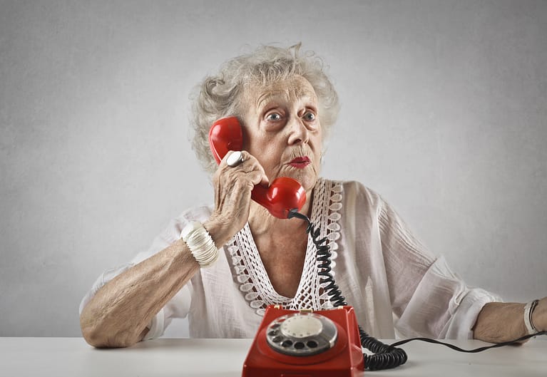 Older women on rotary dial phone